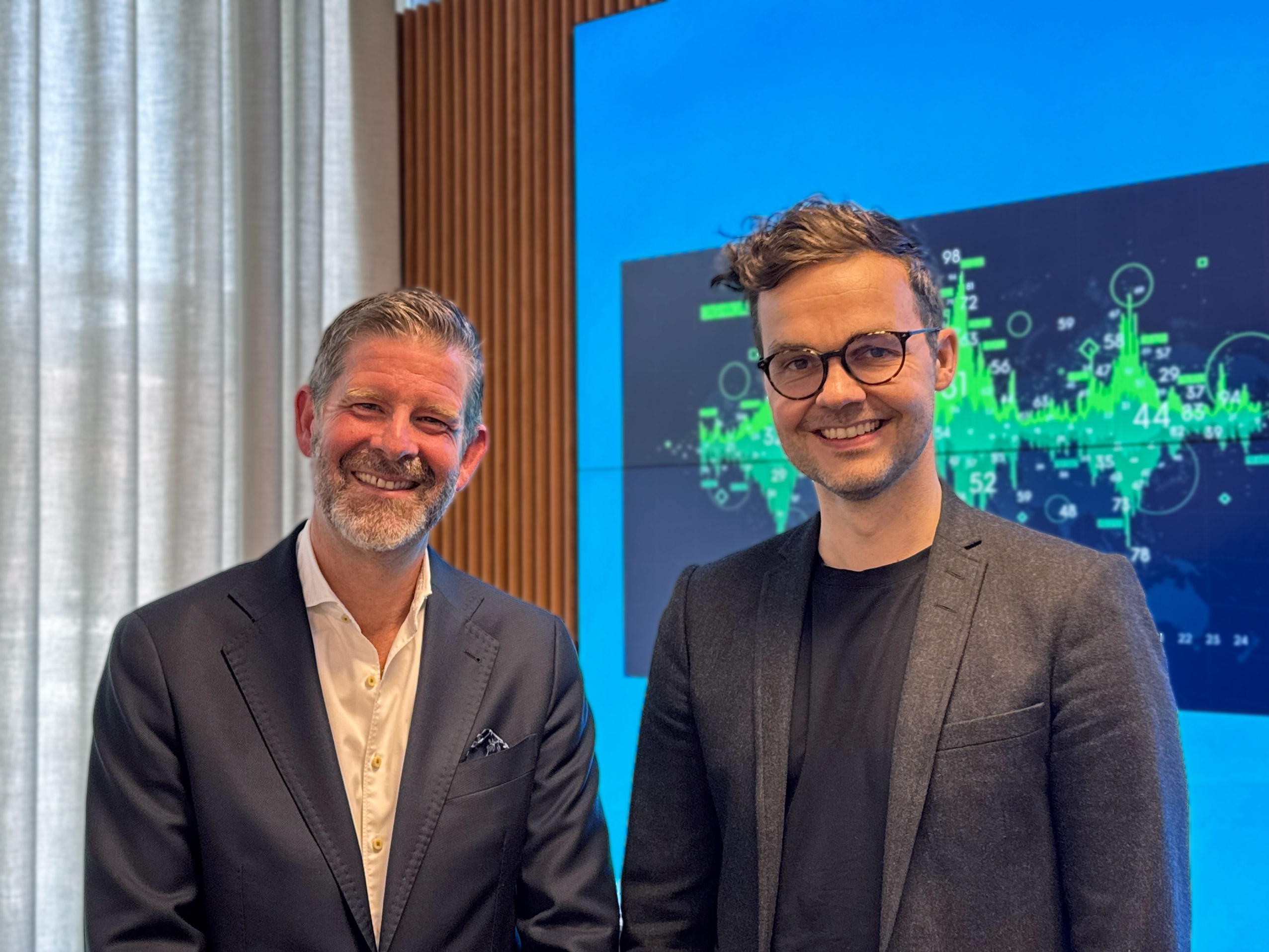 Two people standing facing the camera